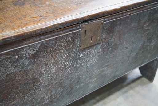 A 17th century oak six plank coffer, length 130cm, depth 37cm, height 58cm